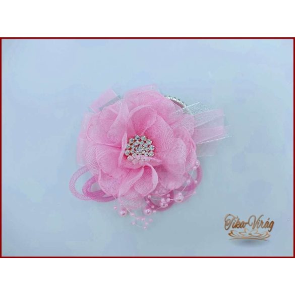 Rózsaszín színű csuklódísz strasszos karkötőn 